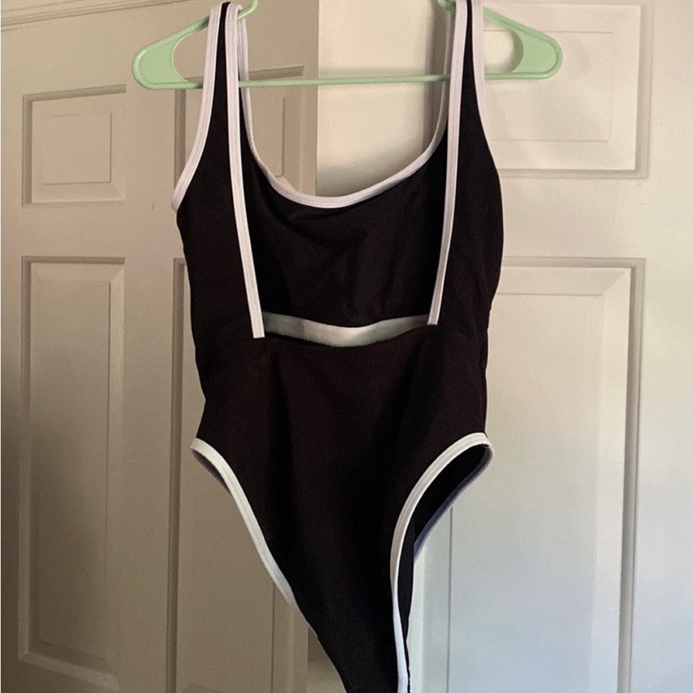 Ribbed, high cut, one piece.  New, never worn. Amazing quality.